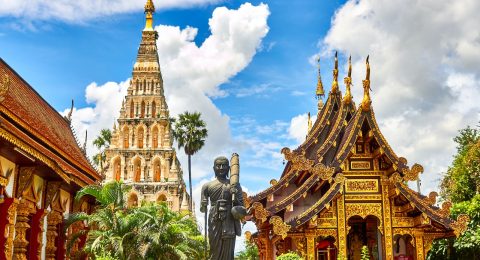 standing statue and temples landmark during daytime