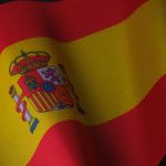 the flag of spain is waving in the wind